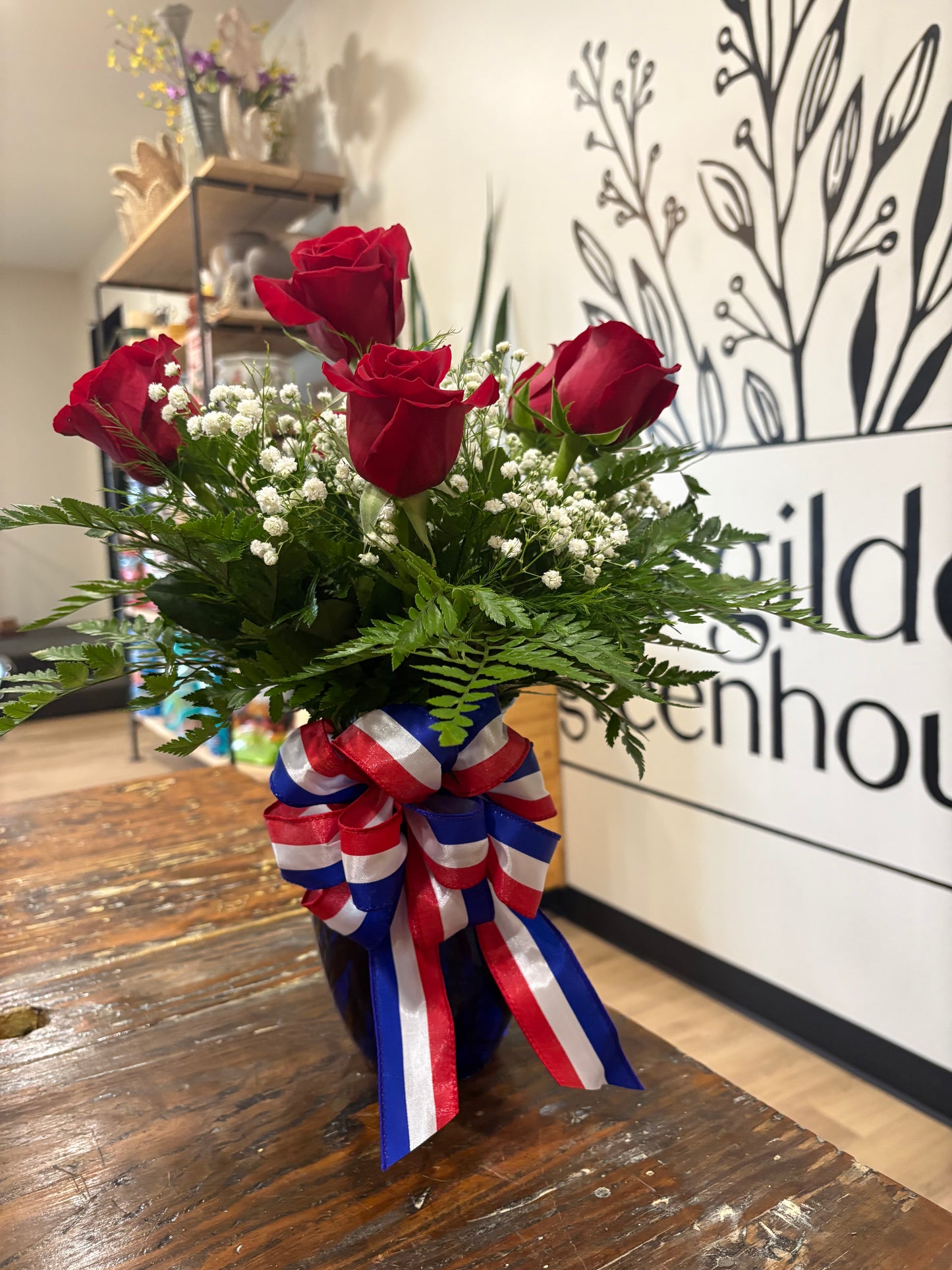 Half dozen red roses with patriotic bow