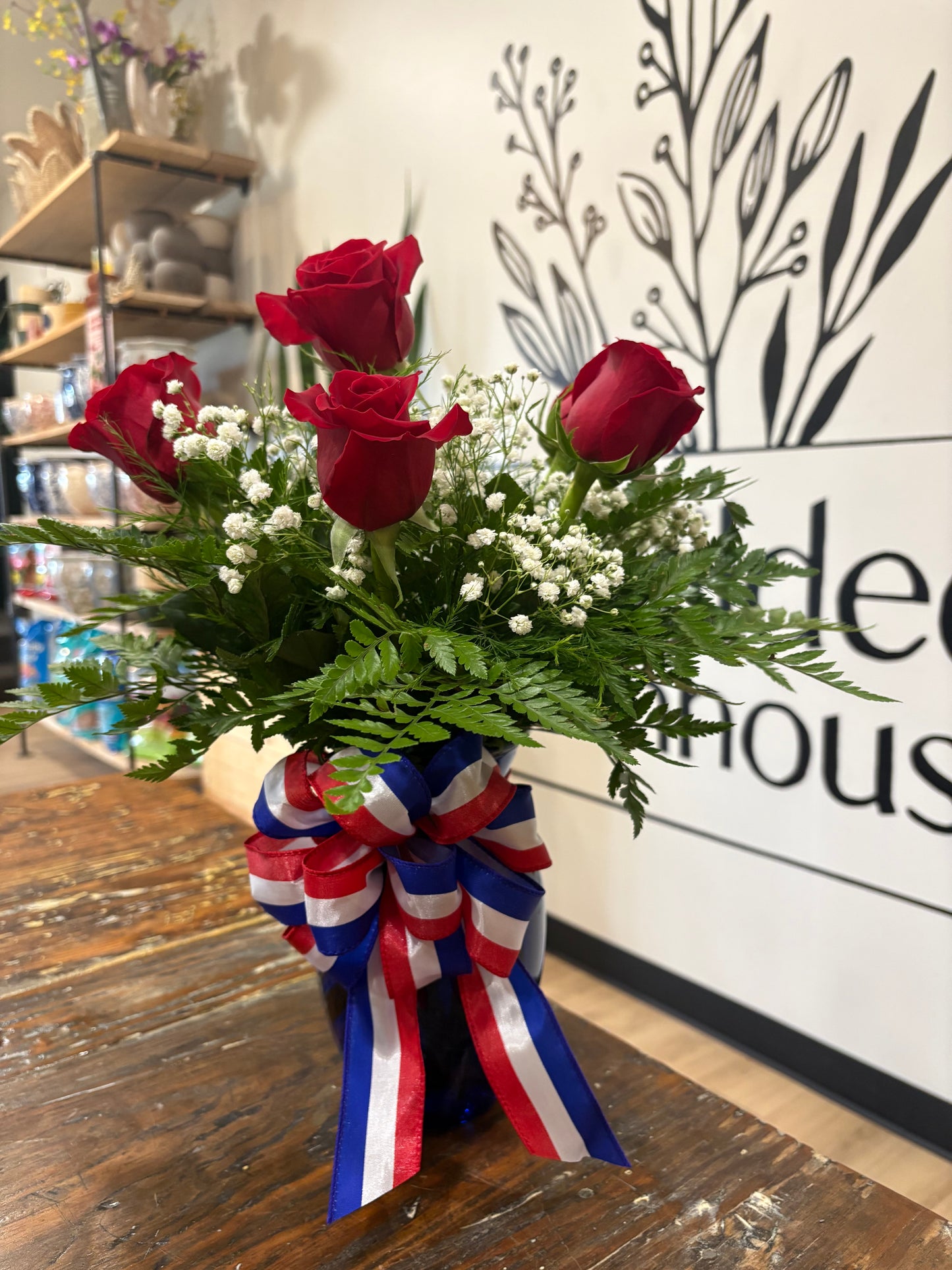 Half dozen red roses with patriotic bow
