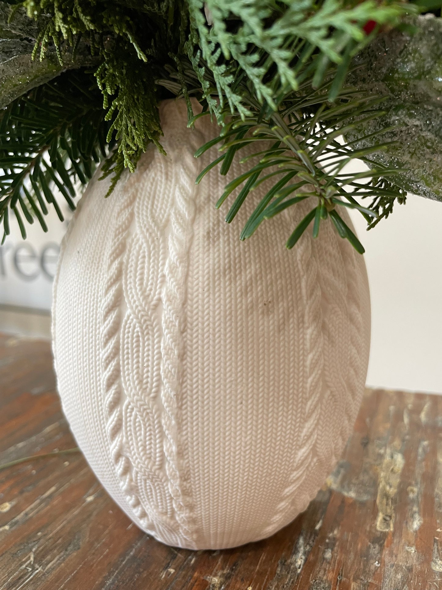 White sweater vase arrangement