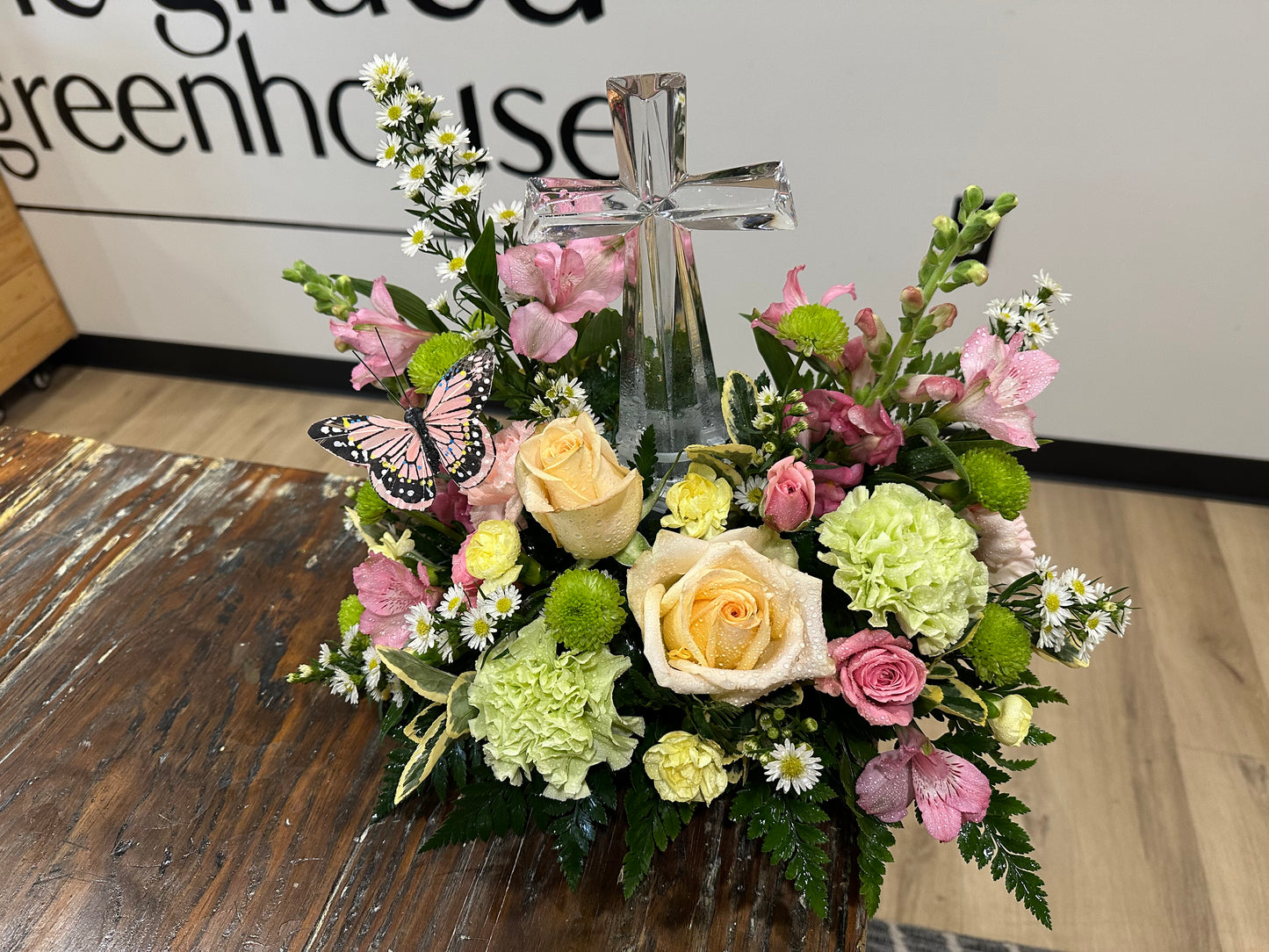 Spring-inspired glass cross